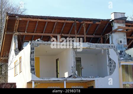 House demolition. A damaged house. A house is being demolished. A destroyed house Stock Photo