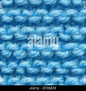Blue knitted fabric seamless pattern for borderless fill. Knitted fabric repeating pattern for background close up. Stock Photo