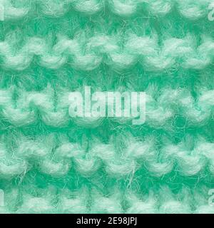 Turquoise, mint color knitted fabric seamless pattern for borderless fill. Knitted fabric repeating pattern for background close up. Stock Photo