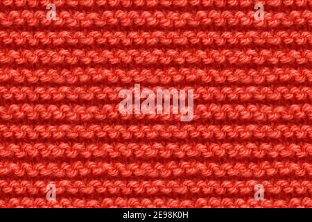 Red Knitwear Fabric Texture. Machine Knitting Texture Macro Snapshot. Knitted Background. Stock Photo