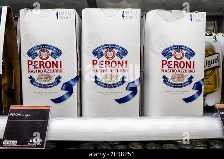 Packs of Peroni lager beer in a supermarket chiller cabinet Stock Photo