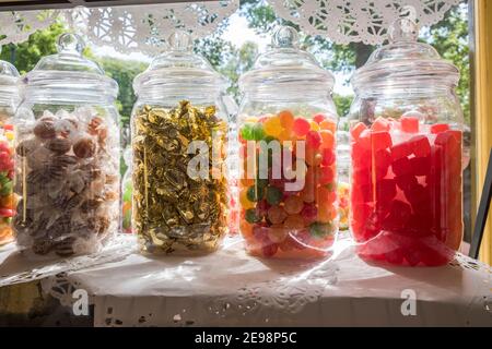 Jars of sweets in a shop window Stock Photo