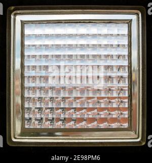 Closeup shot of a glass brick also known as glass block texture, dark frame, square crop Stock Photo