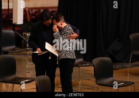 WASHINGTON, DC - FEBRUARY 3: A woman is comforted after attending the Congressional ceremony memorializing U.S. Capitol Police Officer Brian D. Sicknick, 42, as he lies in honor in the Rotunda of the Capitol on Wednesday, February 3, 2021. Officer Sicknick was responding to the riot at the U.S. Capitol on Wednesday, January 6, 2021, when he was fatally injured while physically engaging with the mob. Members of Congress paid tribute to the officer on Wednesday morning before his burial at Arlington National Cemetery. (Photo by Demetrius Freeman/Pool/Sipa USA) Stock Photo