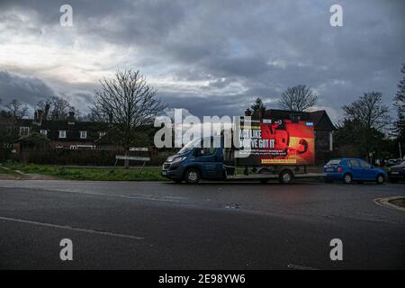 WIMBLEDON LONDON, UK 3 February 2021. A van on Wimbledon Common carries a  message by NHS England which is  displayed on  a digital board  as part of the government publicity campaign urging members of the public to stay at home, protect the NHS and save lives to stop the spread of coronavirus infections.  Credit: amer ghazzal/Ģ����ý Live News Stock Photo