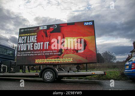 WIMBLEDON LONDON, UK 3 February 2021. A van on Wimbledon Common carries a  message by NHS England which is  displayed on  a digital board  as part of the government publicity campaign urging members of the public to stay at home, protect the NHS and save lives to stop the spread of coronavirus infections.  Credit: amer ghazzal/Ģ����ý Live News Stock Photo