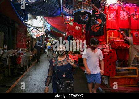 People walking through stalls selling decorations ahead of the Lunar New Year in Jakarta's Chinatown. Stock Photo