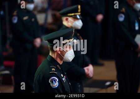 Washington, DC, USA. 3rd Feb, 2021. U.S. Capitol Police Officers attend the Congressional ceremony memorializing U.S. Capitol Police Officer Brian D. Sicknick, 42, as he lies in honor in the Rotunda of the Capitol on Wednesday, February 3, 2021. Officer Sicknick was responding to the riot at the U.S. Capitol on Wednesday, January 6, 2021, when he was fatally injured while physically engaging with the mob. Members of Congress paid tribute to the officer on Wednesday morning before his burial at Arlington National Cemetery. Credit: Demetrius Freeman/Pool Via Cnp/Media Punch/Alamy Live News Stock Photo