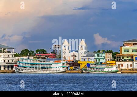 Inland passenger and cargo vessels / ferry boats moored at village along the Madeira River, Rondônia in the upper Amazon River basin, Brazil Stock Photo