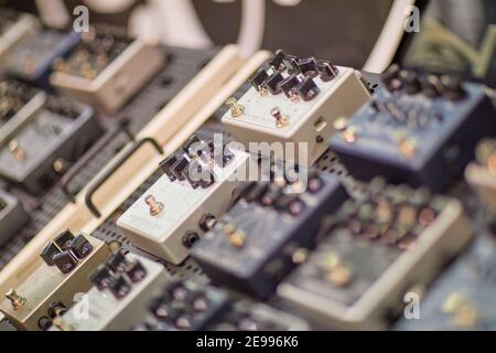 Guitar Effect Pedals on pedalboard in studio Stock Photo