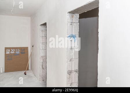 Freshly laid gypsum on the walls and ceiling of a newly built detached house. Stock Photo