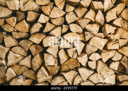 Lots of firewood or wood logs rustic background texture. Stock Photo