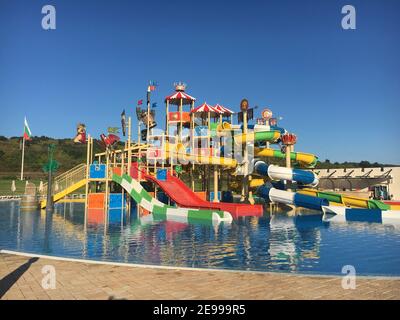 colorful water park twisted water slide amusement resort for luxury children and family vacations on a warm sunny tropical day stock photo alamy