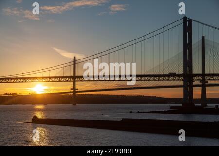 The Forth Road Bridge and Queensferry Crossing at sunset North Queensferry near Edinburgh Scotland. Stock Photo