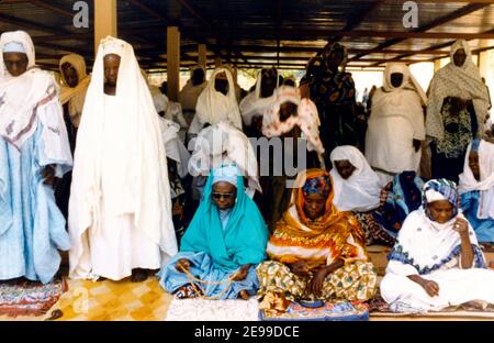 Niger Women Praying with Prayer Beads Stock Photo