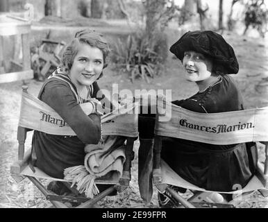 MARY PICKFORD on set candid portrait sitting on back of truck during ...