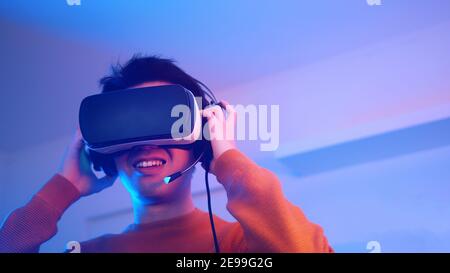 young man surprised by something in virtual reality. High quality photo Stock Photo