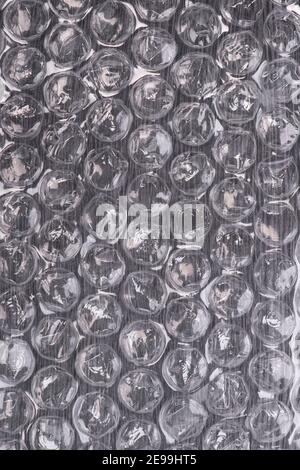 Packaging with air bubbles, bubble wrap texture. Parcel, abstract. Stock Photo
