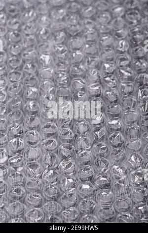 Packaging with air bubbles, bubble wrap texture. Parcel, abstract. Stock Photo