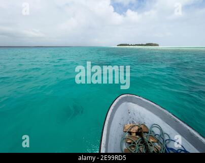 Shallow atoll turquoise waves around Mnemba island in the Indian ocean near the Zanzibar island, Tanzania. Exotic countries traveling concept image. Stock Photo