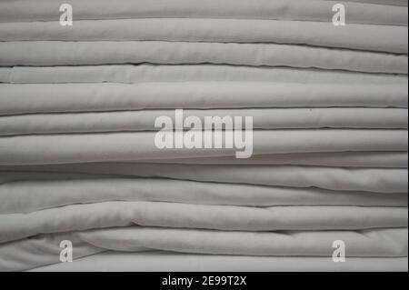 A clean white stack of folded sheets fills the entire frame. Stock Photo