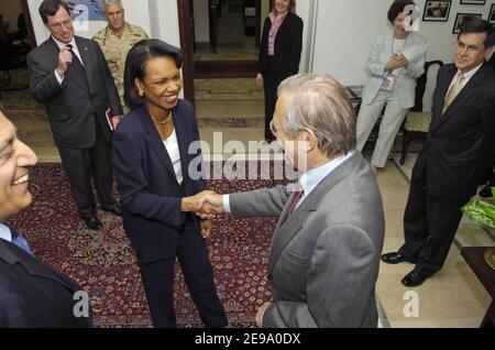 Secretary of Defense Donald Rumsfeld greets Secretary of State Condoleezza Rice in Baghdad, Iraq, on April 26, 2006. Rumsfeld and Rice made an unannounced visit to Iraq to meet jointly with Iraq's newly designated Prime Minister Jawad al-Maliki to show support for the continuing process of building a new Iraqi government. Photo by DoD via ABACAPRESS.COM Stock Photo