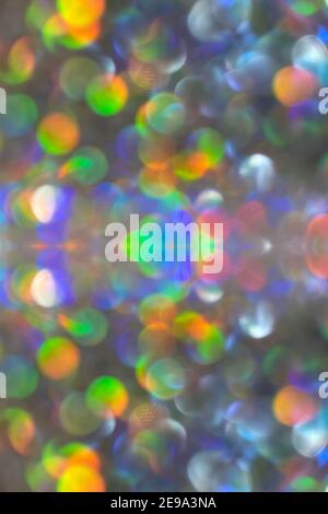 Extreme macro shot of defocused bokeh background multicolored silver details with multiple sparkles Stock Photo