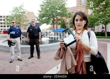 Carie Lemack holds a framed photograph of her mother in front of the federal court building after learning that the jury sentenced self-professed al-Qaida terrorist Zacarias Moussaoui to life in prison May 3, 2006 in front of the federal court building in Alexandria, Virginia. Lemack's mother was a passenger in American Airlines Flight 11 and was killed in the attacks of September 11, 2001. Photo by Olivier Douliery/ABACAPRESS.COM Stock Photo