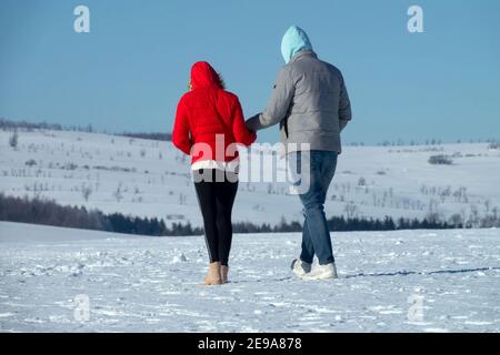 Couple walking holding hands Stock Photo