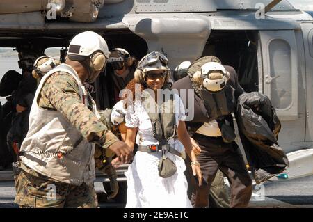 Actress Halle Berry arrives the amphibious assault ship USS Kearsarge (LHD 3) as it sails into New York harbor during the parade of ships, kicking off Fleet Week New York City 2006. Halle Berry, a.k.a. 'Storm' stars in the upcoming 'X-Men: The Last Stand' visited with Sailors and embarked Marines during the opening day of Fleet Week on May 24, 2006. The crew was also given a special sneak preview of the film before its worldwide release date of May 26, 2006. Photo by USN via ABACAPRESS.COM Stock Photo