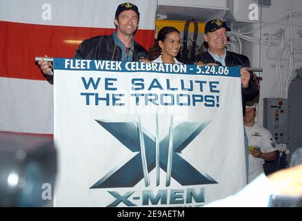 In the hangar bay aboard amphibious assault ship USS Kearsarge (LHD 3), actors Hugh Jackman, a.k.a 'Wolverine', Halle Berry, a.k.a 'Storm' and Kelsey Grammer, a.k.a. 'Dr. Henry McCoy' display a banner announcing the premiere of their latest movie, the upcoming 'X-Men: The Last Stand' visited with Sailors and embarked Marines during the opening day of Fleet Week 2006 in New York, NY, USA on May 24, 2006. The crew was also given a special sneak preview of the film before its worldwide release date of May 26, 2006. Photo by USN via ABACAPRESS.COM Stock Photo