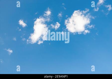 Clear blue sky with beautiful little fluffy white clouds Stock Photo