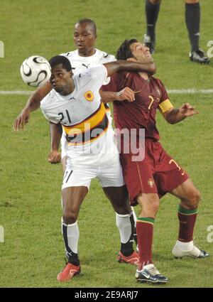 Portugal's Luis Figo and Angola's Delgado in action during the World Cup 2006, Group D, Angola vs Portugal in Cologne, Germany on June 11, 2006. Portugal won 1-0. Photo by Gouhier-Hahn-Orban/Cameleon/ABACAPRESS.COM Stock Photo