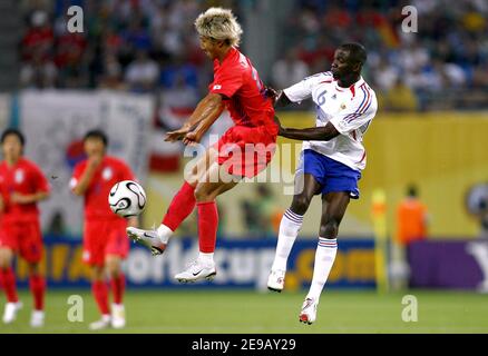 South Korea's Chun-soo Lee and France's Claude Makelele battle for the ball during the World Cup 2006, Group G France vs South Korea, in Leipzig, Germany, on June 18, 2006. The game ended in draw 1-1. Photo by Christian Liewig/ABACAPRESS.COM Stock Photo