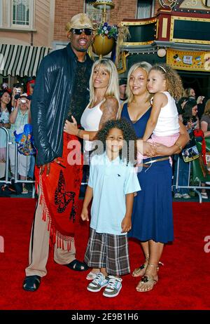 Dennis Rodman and wife Michelle attend the world premiere of Pirates of ...