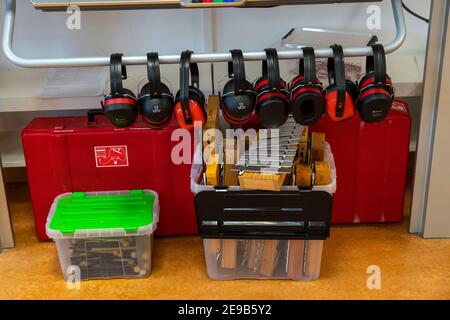Musical instruments, hearing protection for noise-reduced work in the classroom, primary school, modern equipped school, new building, empty, during l Stock Photo
