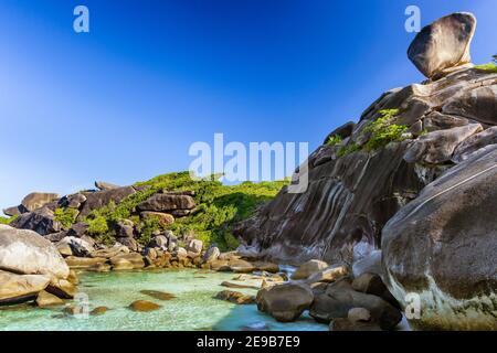 Crystal clear water and granite rocks on a tropical island paradise (Similan Islands, Thailand) Stock Photo