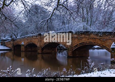 An evening walk in the snow-covered Abbey Park. It was cloudy and snowing. But at this time, the park is even more impressive Stock Photo