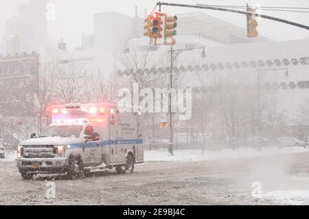 New York City USA Ambulance coming from Lenox Health Greenwich Village in a snow storm Stock Photo