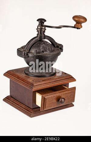 Old wooden coffee mill on an isolated studio background Stock Photo