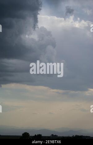 A short rainstorm leaves several different shapes and sizes of clouds behind when finished. Stock Photo