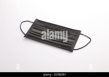 Used black mask isolated in white background Stock Photo - Alamy