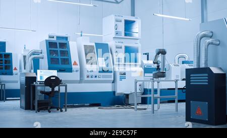 Industry 4.0 Modern Factory: AI Optimized and Automated High-Tech Contemporary Industrial Electronics Manufacturing Plant with CNC Machines and Stock Photo