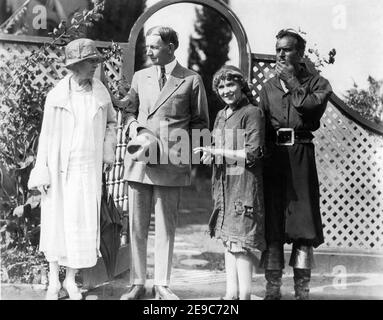 Visitors Vice President CHARLES G. DAWES and his Wife CARO DANA DAWES movie studio lot candid in Summer 1925 with MARY PICKFORD in costumes for SPARROWS 1926 director WILLIAM BEAUDINE Pickford Corporation / United Artists and DOUGLAS FAIRBANKS Sr. in costume for THE BLACK PIRATE 1926 director ALBERT PARKER story Douglas Fairbanks (as Elton Thomas) 2 Strip Technicolor Elton Corporation / United Artists Stock Photo