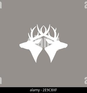 two deer heads logo. vector flat silhouette isolated on beige background. Wild animal symbol. Adventure, camping, traveling concept. Christmas, winter Stock Vector