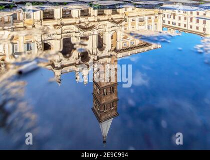 Frequent rain showers create pools in which the wonderful Old Town of Rome reflects like in a mirror. Here in particular Santa Maria Maggiore Stock Photo