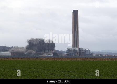 The boiler house is brought down as demolition work continues at Longannet power station in Fife. Longannet, which closed in 2016, was Scotland's last coal-fired power station. Picture date: Thursday February 4, 2021. Stock Photo