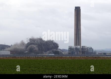 The boiler house is brought down as demolition work continues at Longannet power station in Fife. Longannet, which closed in 2016, was Scotland's last coal-fired power station. Picture date: Thursday February 4, 2021. Stock Photo