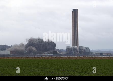 The boiler house is brought down as demolition work continues at Longannet power station in Fife. Longannet, which closed in 2016, was Scotland's last coal-fired power station. Picture date: Thursday February 4, 2021. Stock Photo