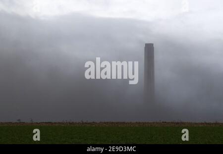 The boiler house is brought down as demolition work continues at Longannet power station in Fife. Longannet, which closed in 2016, was Scotland's last coal-fired power station. Picture date: Thursday February 4, 2021. Stock Photo